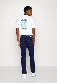Tommy Jeans AUSTIN SLIM TPRD - Jeans Tapered Fit - denim dark