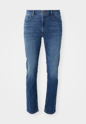 Blå denim jeans med rett snitt, fem lommer og glidelås. Har subtil falming og kontrastsøm langs sømmene.
