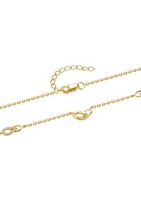 Gold chain bracelet featuring small circular links, a lobster clasp, and an accent link with embedded clear crystals.