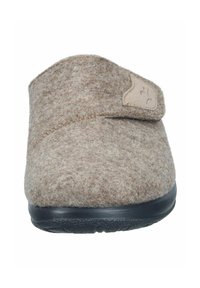 Brown felt slipper with a soft texture, wide opening, Velcro strap, and black rubber sole. Minimal design with a discreet accent logo.
