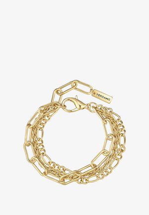 Guld kædearmbånd med sammenkoblede ovale og runde led, udstyret med en krabbe-lås og en graveret mærkat der detaljerer mærket "Yokoami."