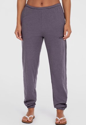 Jogger grigi leggeri con vestibilità rilassata, vita elastica e caviglie con polsini, caratterizzati da un logo discreto sul lato.