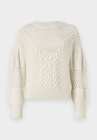 Pull court de couleur crème avec un motif en tricot torsadé, des accents en dentelle et des poignets côtelés. Il présente un motif texturé sur les épaules.