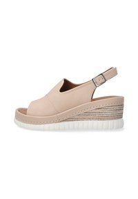 Beige leather wedge sandal with open toe, slingback strap, and a textured woven midsole. Features white rubber outsole and stitching detail.