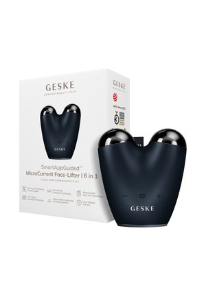 Appareil GESKE MicroCurrent Face-Lifter noir avec deux sphères argentées arrondies, boutons plus et moins, présenté à côté de sa boîte blanche de produit.