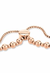 Rose gold bracelet featuring a chain of polished spherical beads and a circular clasp with engraved branding, showcasing smooth texture.