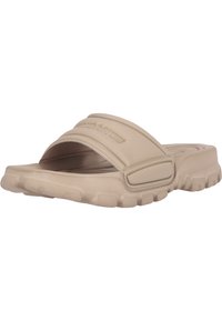 Beige slide sandal made of synthetic material, featuring a wide strap and textured outsole for grip. Accented with brand logo on top.