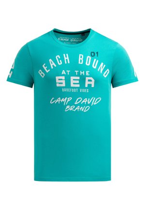 Turquoise short-sleeve T-shirt with white and black text reading "Beach Bound at the Sea, Barefoot Vibes, Camp David Brand," size M.