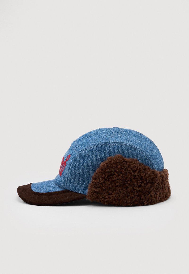 Blue denim cap with brown suede brim and thick brown fleece ear flaps, featuring red embroidered design on front panel.