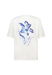 White cotton t-shirt featuring a blue floral design on the back, with text "The Botanical Garden, Central Park, NY" beneath.