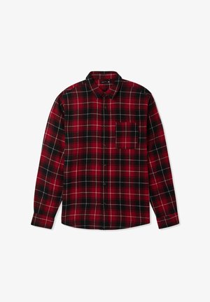 Camicia flanella a quadri rossa e nera con maniche lunghe, chiusura a bottoni davanti e una tasca sul petto. Tessuto morbido con linee bianche a contrasto nel motivo.