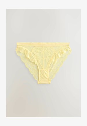 Yellow lace thong underwear featuring floral patterns, a soft texture, and a smooth waistband. Back has scalloped lace edges.