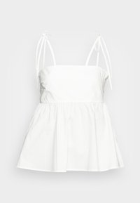 Top peplum branco com alças finas ajustáveis, cintura franzida e tecido de algodão suave. Design simples com um ajuste relaxado e silhueta evasê.