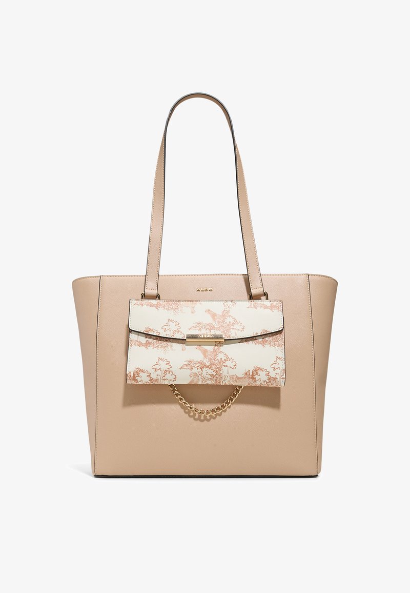 Beige schoudertas met een gladde textuur, voorzien van een afneembare flap met een patroon in crème en lichtroze. Kettingaccent op de flap sluit met een haaksluiting.
