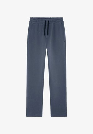 Pantalons de survêtement bleu marine avec une taille élastique, un cordon noir et des poches latérales ; fabriqués en tissu doux et léger.