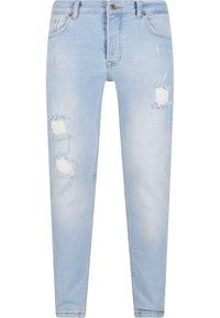 Vaaleansiniset skinny-farkut, joissa on revityt kohdassa polvia, klassinen viiden taskun muotoilu ja metallinen napitus.