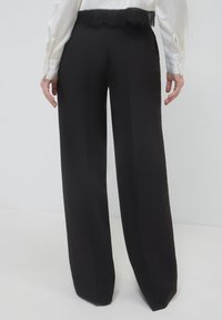 Calliope PALAZZO FASCIA  - Pantaloni - nero