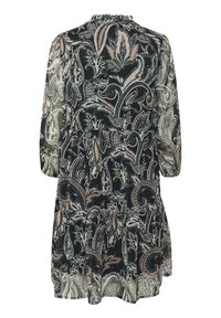 Black dress with paisley pattern in beige and green, semi-sheer fabric, three-quarter sleeves, gathered neckline, and tiered hem.