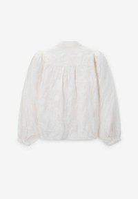 White blouse with long puff sleeves, floral embroidery texture, button cuffs, and a back yoke detail. Soft fabric with a slight sheen.