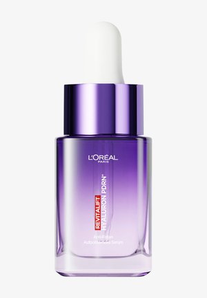 Bottiglia viola di siero L'Oréal Paris Revitalift Hyaluron con tappo contagocce bianco su sfondo bianco.