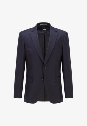 Granatowa marynarka wykonana z gładkiego materiału z dwoma guzikami, bocznymi kieszeniami i klapami w szpic; ma wzorzystą podszewkę.