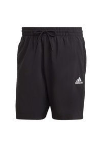 Fekete sportnadrág könnyű anyagból. Gumírozott derékpánt, húzózsinórral. Az Adidas fehér logója a bal alsó részen található.