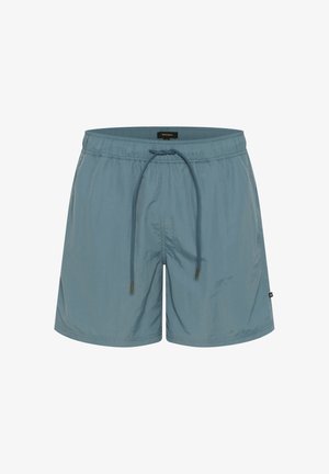 Világoskék fürdőnadrág, amely könnyű anyagból készült, rugalmas derékkal és zsinórral, az oldalon pedig egy kis logó található.