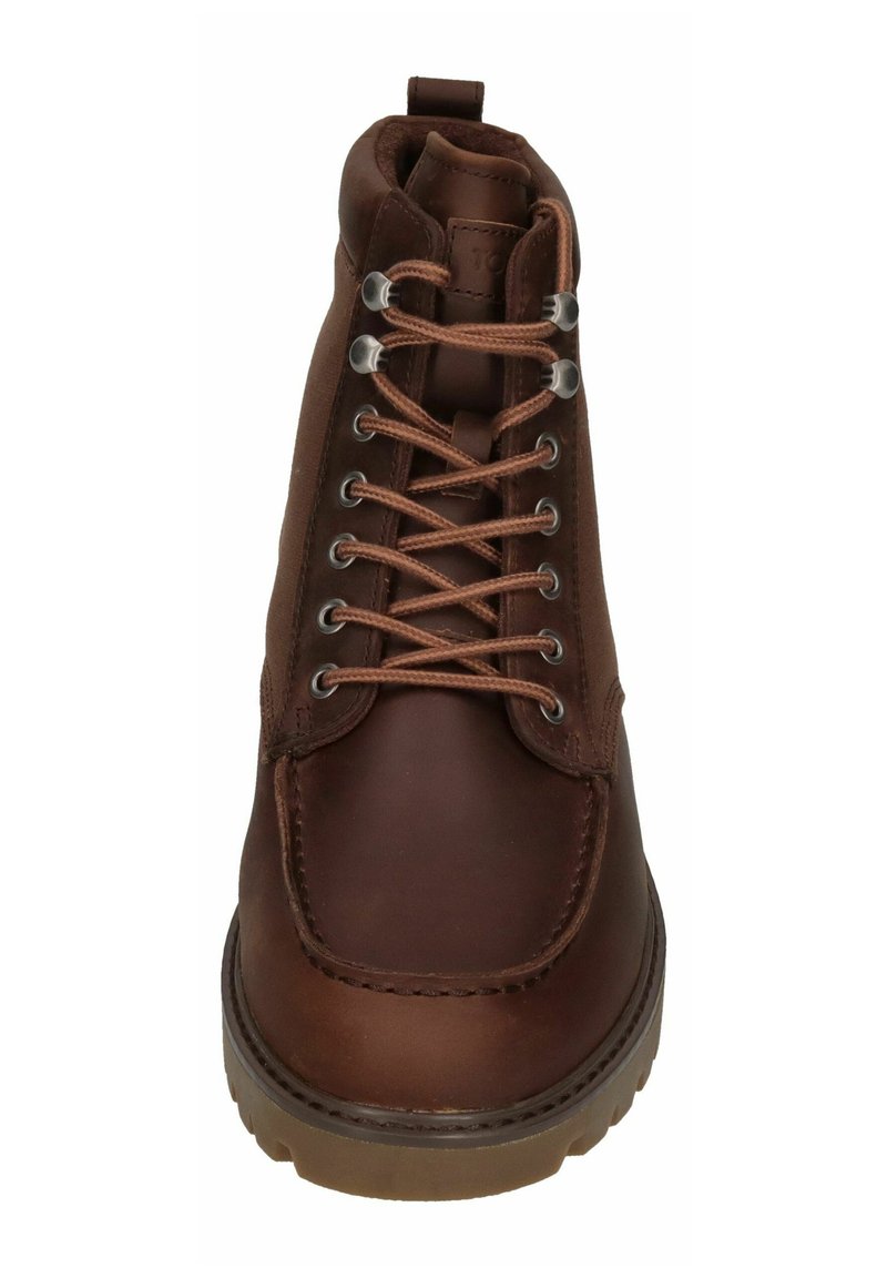 Braune Leder-Ankle-Boots mit Schnürdesign, metallischen Ösen und einer strukturierten Gummisohle. Mit genähten Details um die Zehen versehen.