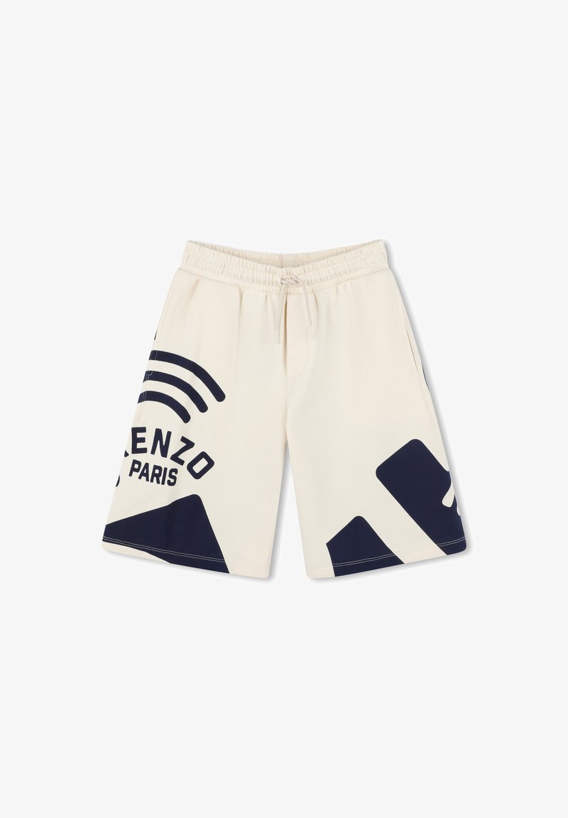 Crème kleurige shorts met een elastische tailleband en koord. Voorzien van marineblauwe branding en geometrische patronen aan de zijkanten.