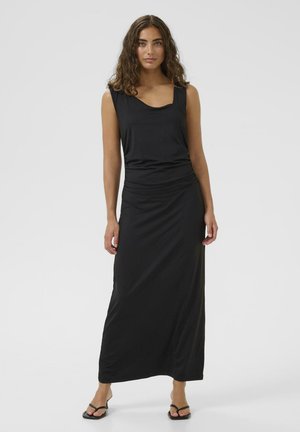 Schwarzes Maxikleid mit Rundhalsausschnitt und ärmellosem Design. Hergestellt aus glattem, leichtem Stoff mit tailliertem Schnitt. Schlichte und elegante Silhouette.