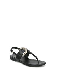 Sandales en cuir noir avec une semelle plate, présentant une grande boucle en argent comme accent et un design minimaliste. Les brides offrent un ajustement à talon ouvert.