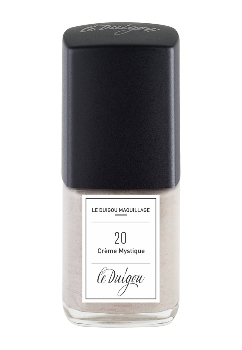Cremefarbener Nagellack in einer klaren Glasflasche mit mattschwarzem Deckel. Das Etikett hat einen weißen Hintergrund mit schwarzem Text und Akzenten.