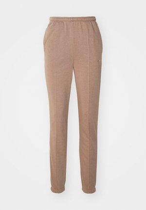 Brown athletic pants with an elastic waistband, side pockets, tapered legs, and subtle Nike logo. Made from soft, textured material.