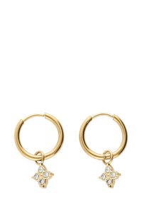 Orecchini a cerchio in oro con un piccolo charm a quattro petali adornato da quattro cristalli trasparenti, che offrono una finitura metallica lucida.