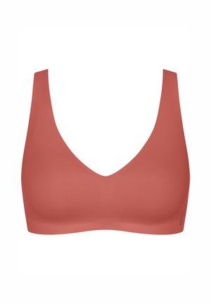 Bra color corallo con spalline larghe, texture liscia e scollatura a V profonda. Costruzione senza cuciture e senza hardware visibile.