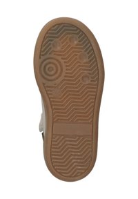 Gummisohle mit strukturierter Oberfläche, die kreisförmige und sechseckige Noppen aufweist. Die Farbe ist beige mit einem Zickzackmuster für besseren Halt.