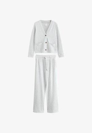 Heleda halli vabaaja komplekt, mis sisaldab nööpidega kardigani kahe eesmine taskuga ja samas toonis elastsete pükstega. Pehme ja tekstuuriga kangas.