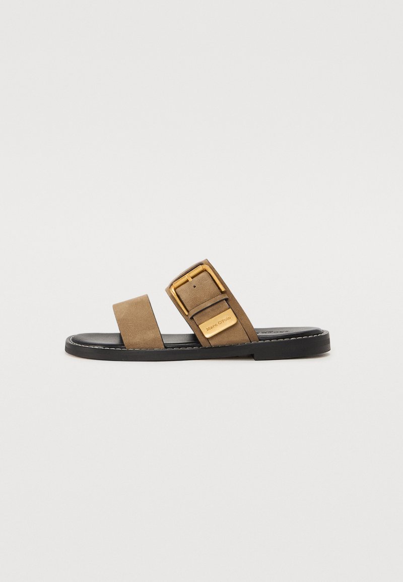 Brown suede slide sandal with two wide straps, featuring a gold-tone buckle. Black sole with tan stitching. Simple and modern design.