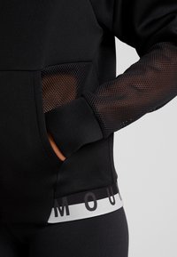 Under Armour Veste de survêtement - black