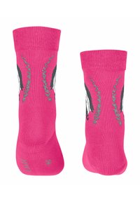 Chaussettes rose vif ornées de graphismes d'animaux en noir et blanc. Texture lisse avec des bords côtelés et des accents décoratifs en argent.
