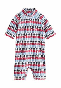 Maillot de bain à manches courtes avec un motif coloré de gardes en manteaux rouges et chapeaux noirs sur un fond bleu clair.