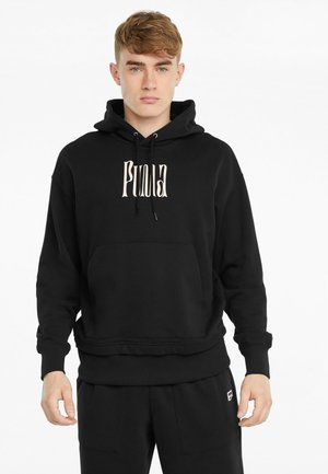 Sweat à capuche noir avec cordons de serrage et poche avant. Présente le logo de la marque en rose clair sur la poitrine. Fabriqué en tissu doux et texturé.