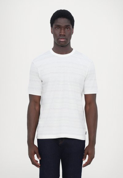 White short-sleeve t-shirt featuring textured horizontal stripes in light blue and orange. Round neckline and standard fit.