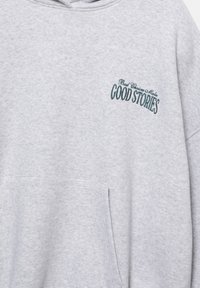 Gray fleece sweatshirt with a hood, featuring a front pocket and embroidered text in teal reading "Good Stories" and "Bad Choices Make."