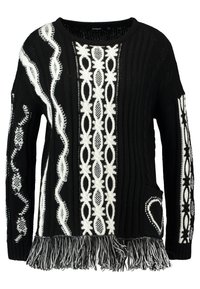 Black knitted sweater with white decorative patterns, featuring a round neckline, ribbed texture, and a fringed hem. Includes a side pocket.