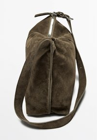 Brown suede handbag with a structured shape, featuring a top zipper closure and a single strap. The surface has a soft texture.