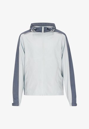 Világoskék szélálló dzseki sötétkék részletekkel, cipzáras előlappal, állítható kapucnival és rugalmas mandzsettákkal. Simább, könnyű anyag.