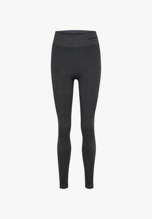 Zwarte naadloze high-waist legging met subtiele textuur op de benen en een klein logo dicht bij de tailleband.