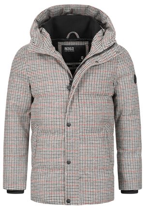 Veste d'hiver rembourrée avec un motif pied-de-poule, présentant des couleurs noire, blanche et rouge, dotée d'une capuche, d'une fermeture éclair et de poches latérales.