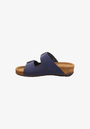 Sandale à glissière en cuir bleu marine avec un bout ouvert, deux larges sangles et un semelle en liège. La semelle texturée et les coutures d'accentuation complètent le design.